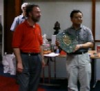 Jaeup Kim receives trophy from Ron Bell