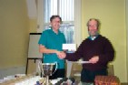 Tony Atkins receives prize money from John Gibson